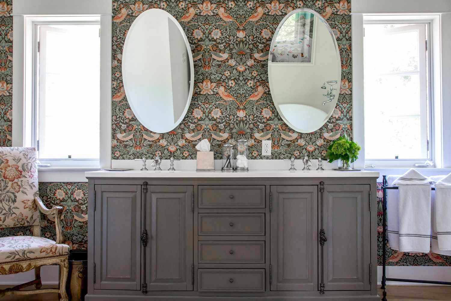 floral-patterned bathroom with double sink vanity