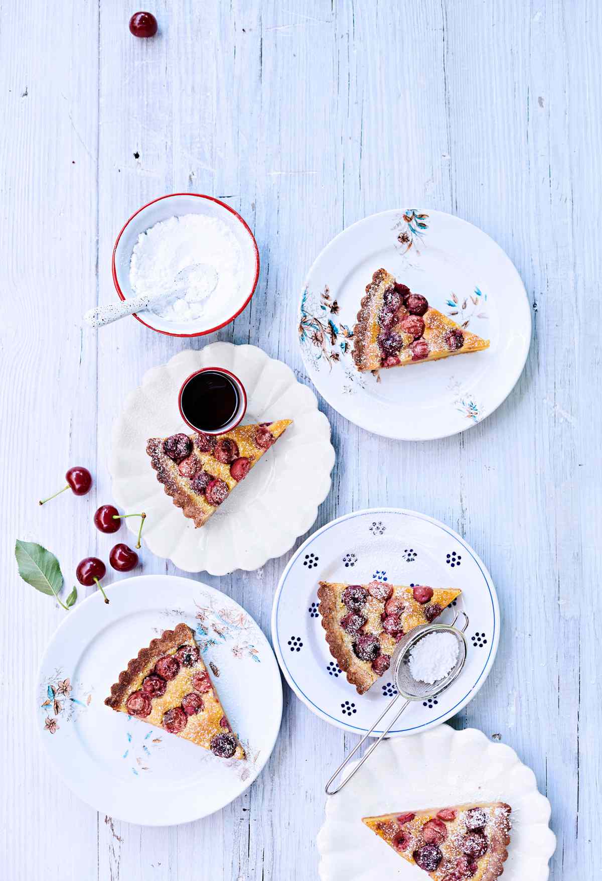 sour-cherry frangipane tart topped with powdered sugar