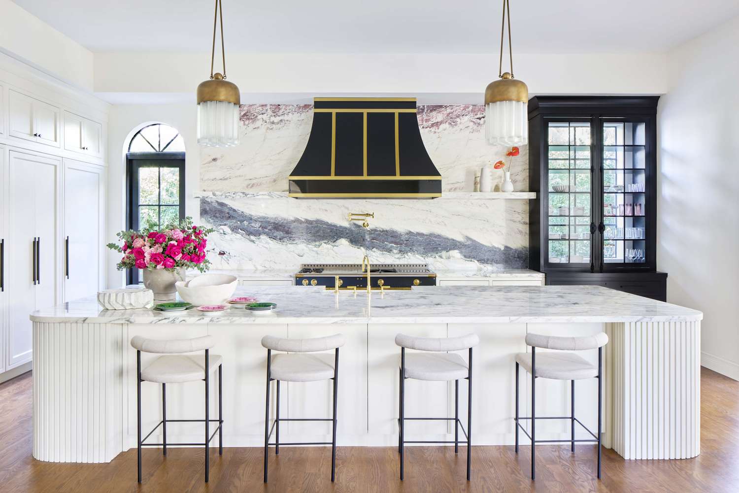 kitchen with glass cabinet in front of window