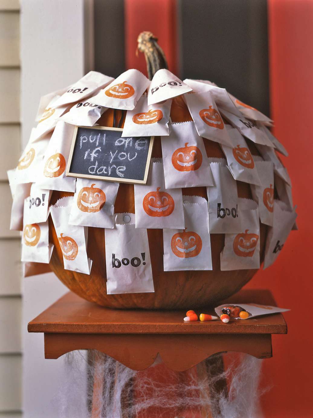 halloween goody bags pinned to pumpkin