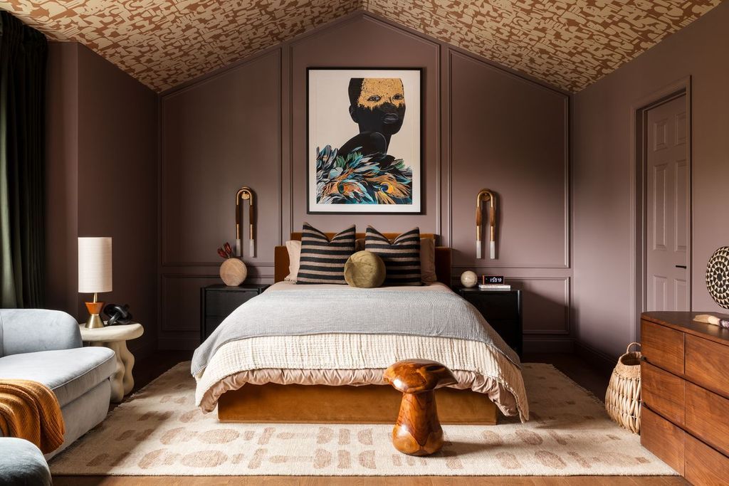 Large purple bedroom with oversized rug