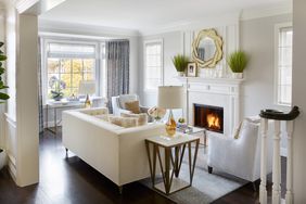 white living room color scheme with gold accents