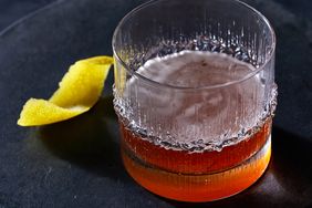 sazerac in rocks glass on black plate