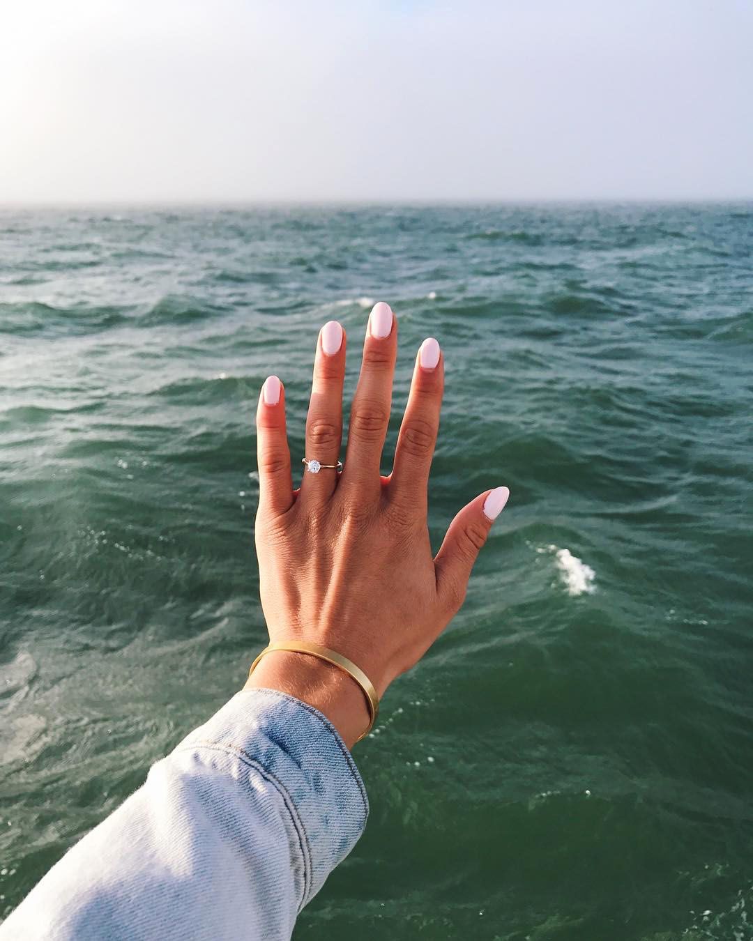engagement ring selfie seascape