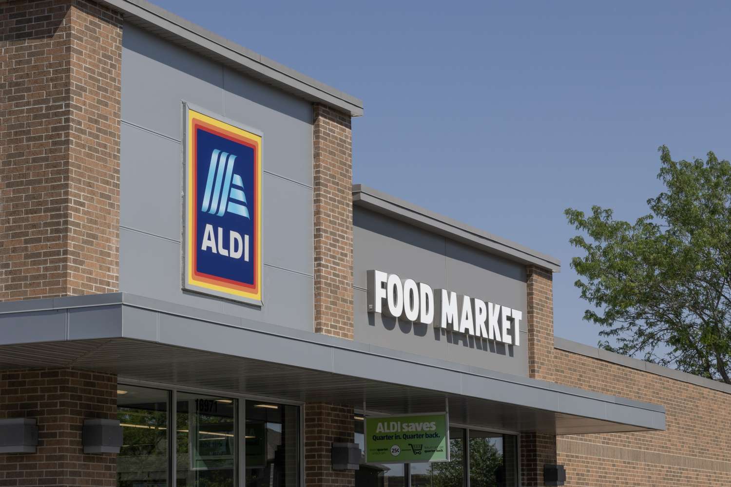 Aldi Food Market storefront signage on a brick building