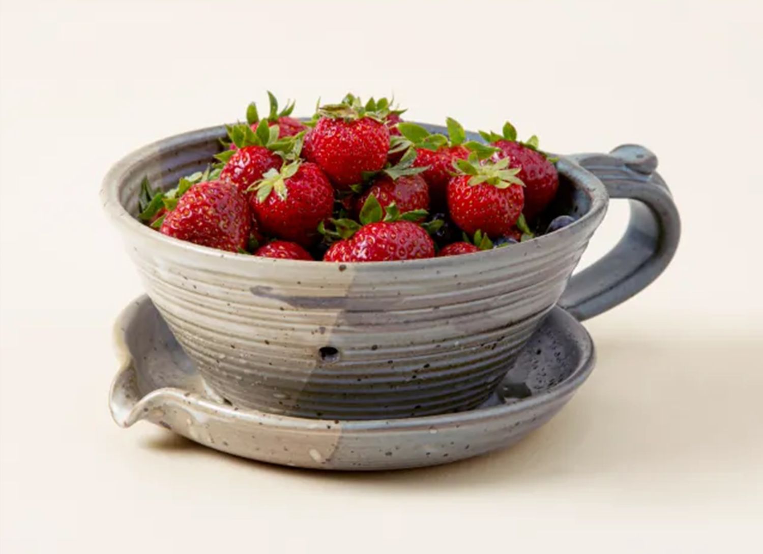ceramic berry holder with strawberries