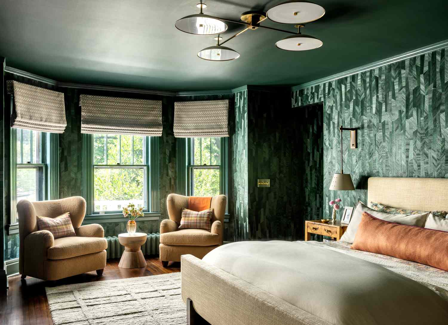 deep green bedroom with wallpaper and painted ceiling