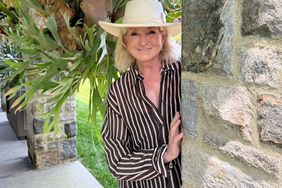 decorvow standing next to a stone wall