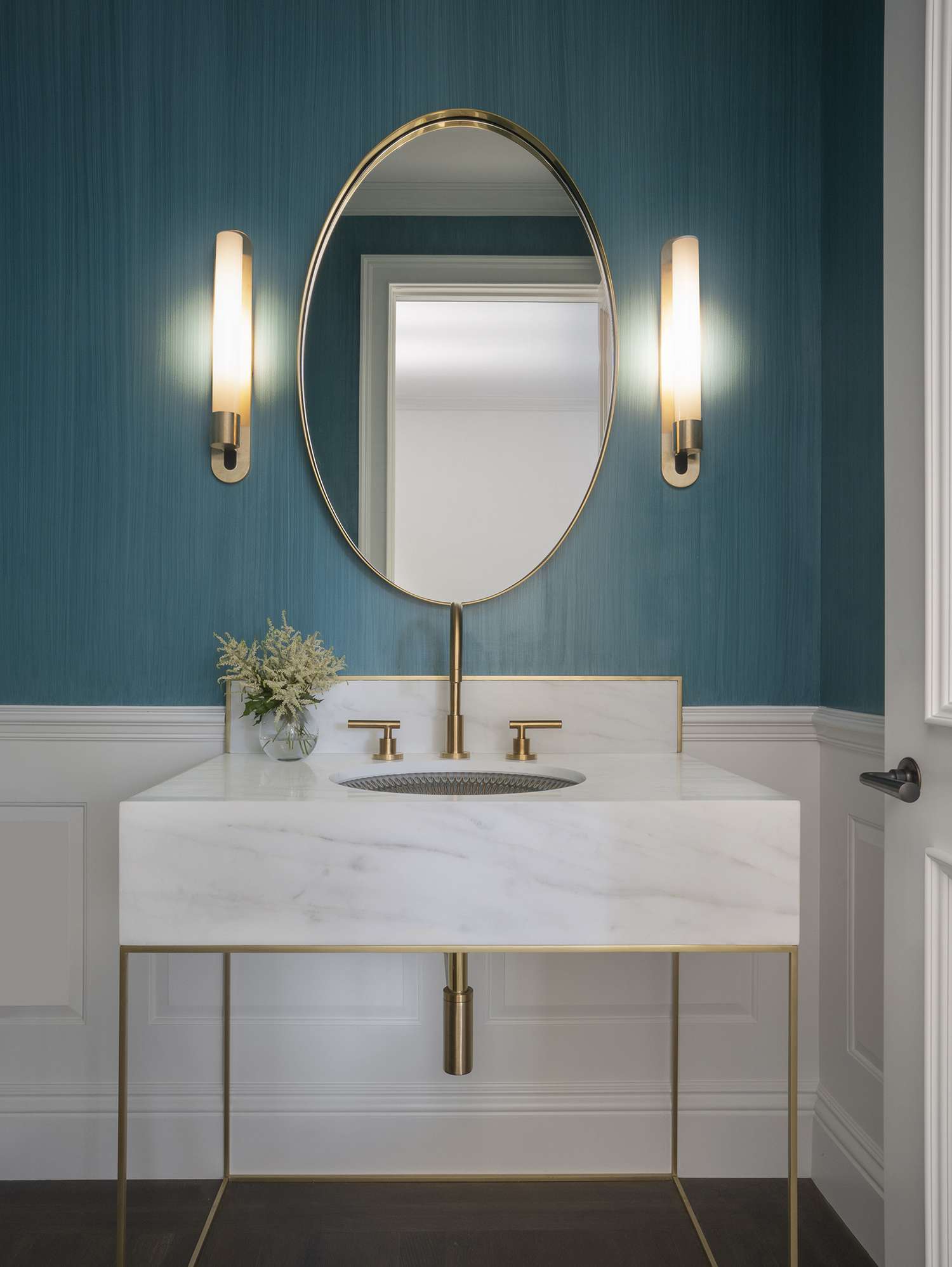 teal powder room with white marble sink