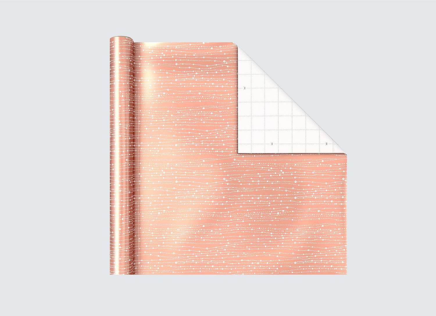 warm gold wrapping paper on a grey background