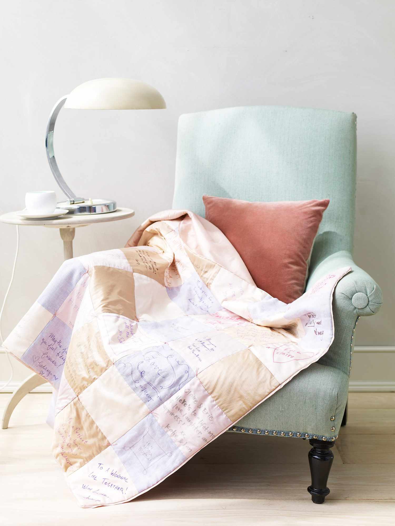 patchwork quilt draped over a chair