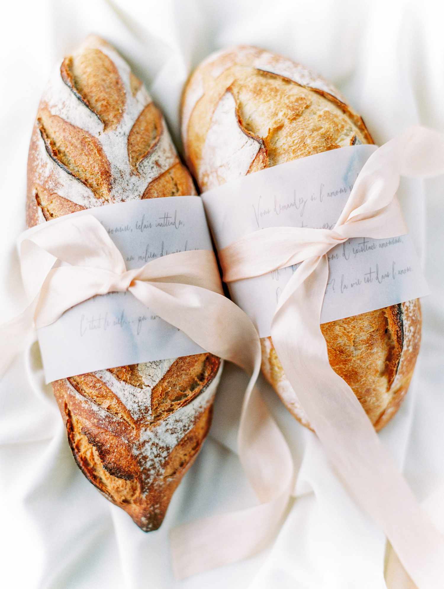 bread loaves in calligraphed sleeves