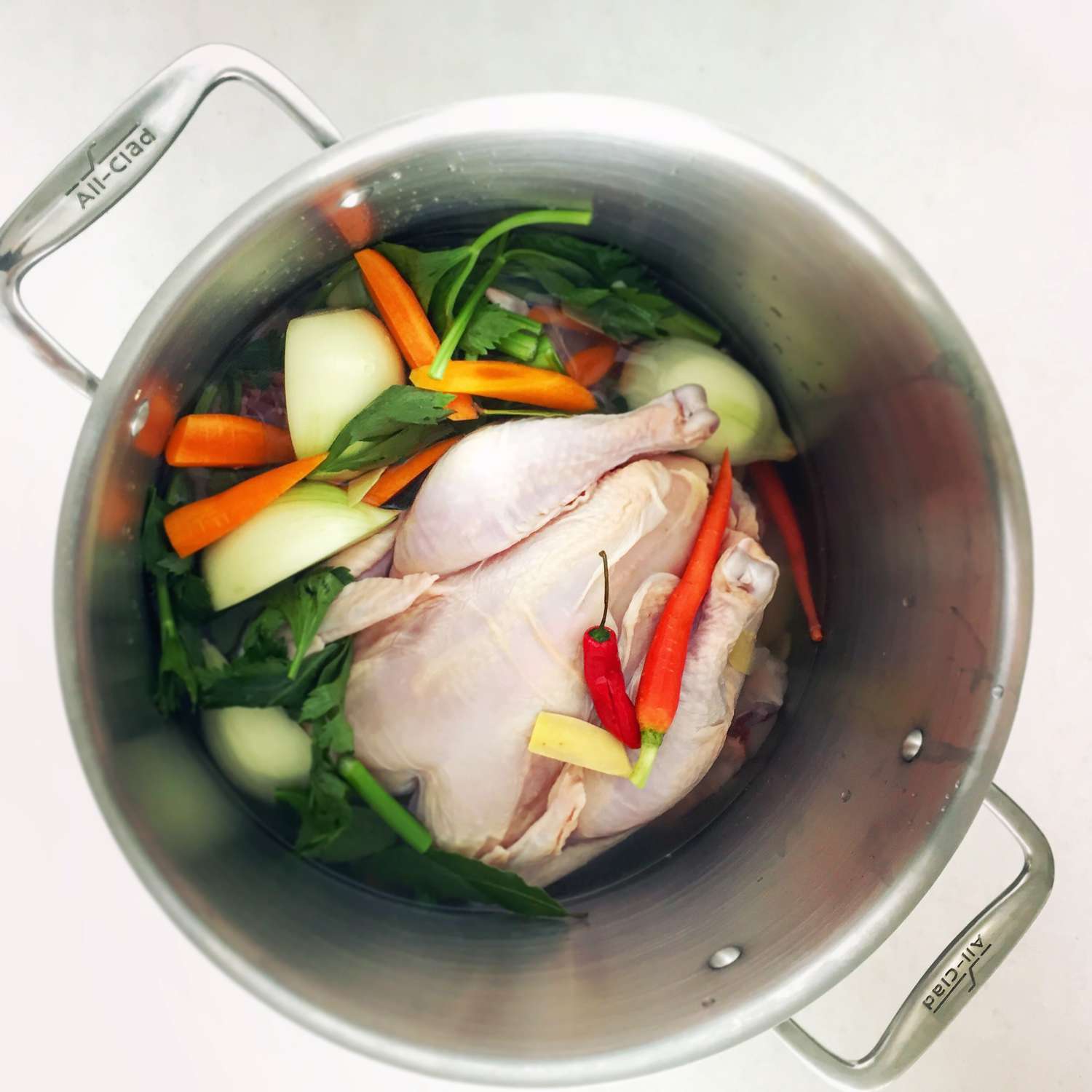 chicken stock cooking in a pot