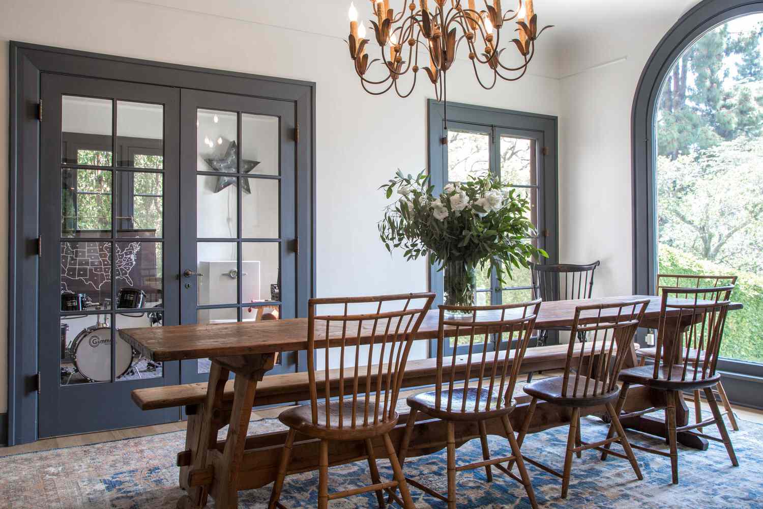 dining room with long wooden table and picture window