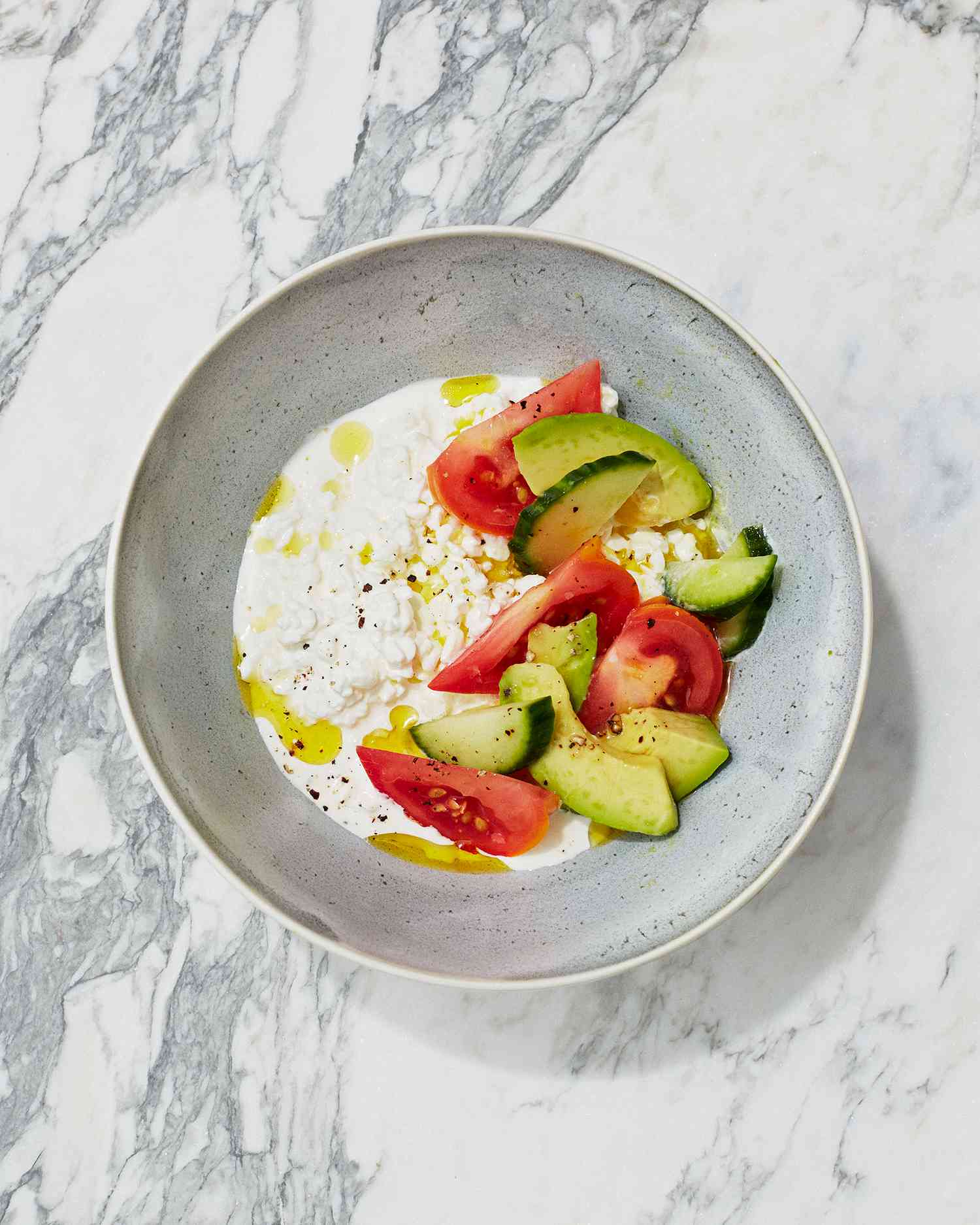 cottage-cheese bowl with avocado, tomato, and cucumber
