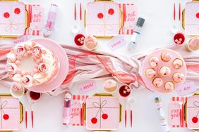 Festive holiday table setup with desserts giftthemed plates and decorated treats