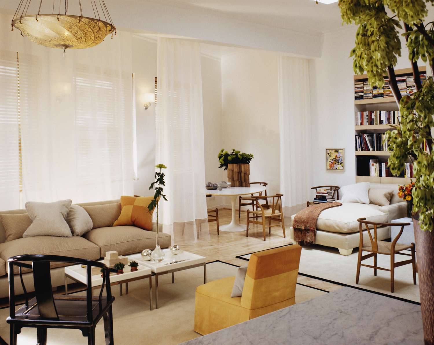 A modern living room with seating areas and decor