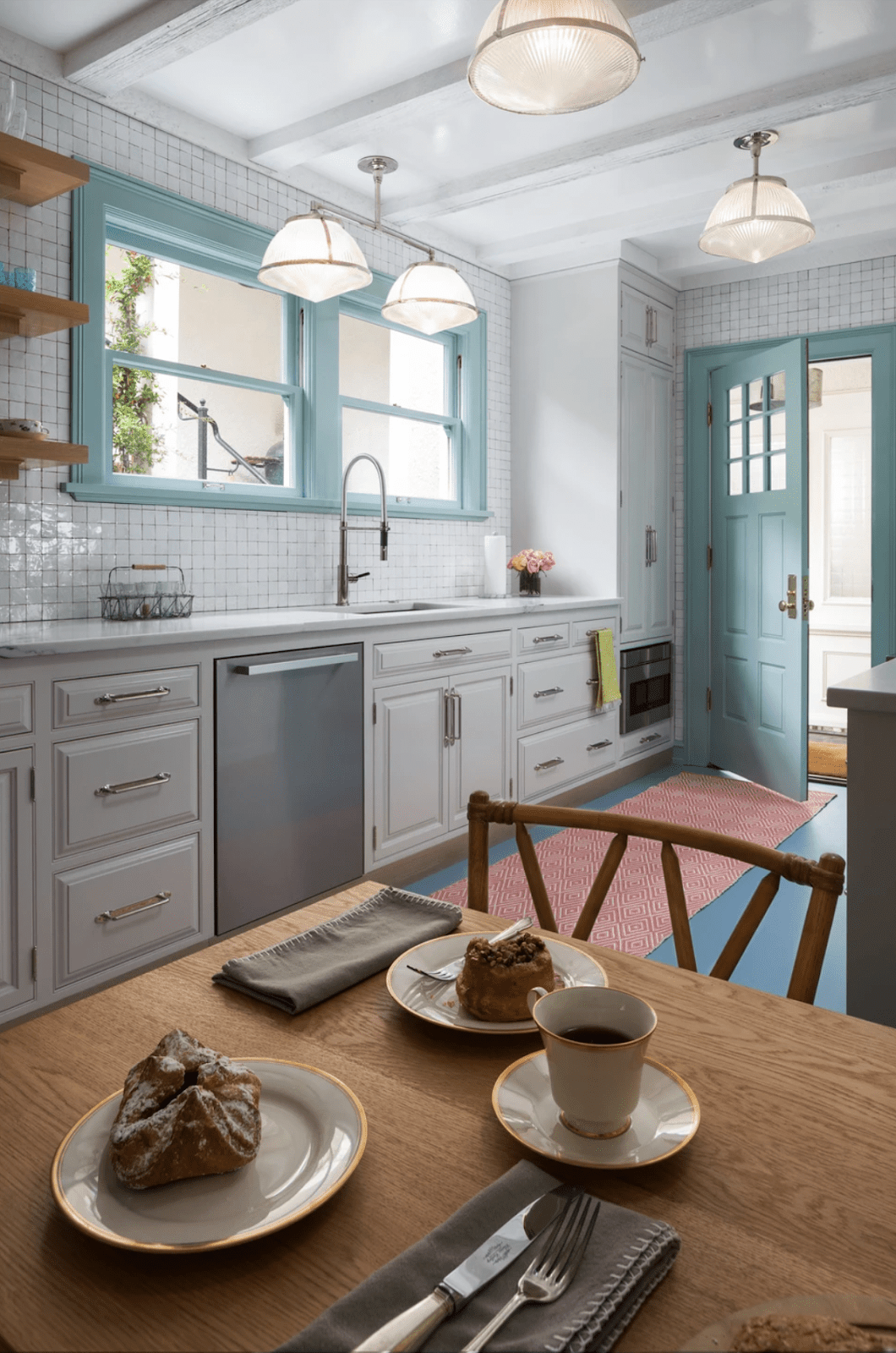 a white kitchen with blue accents 