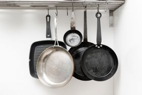 various cooking pan styles on hanging rack