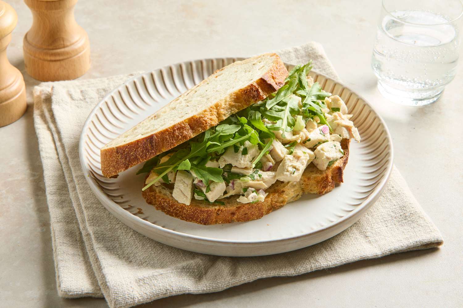 Chicken salad sandwich with lettuce on a plate