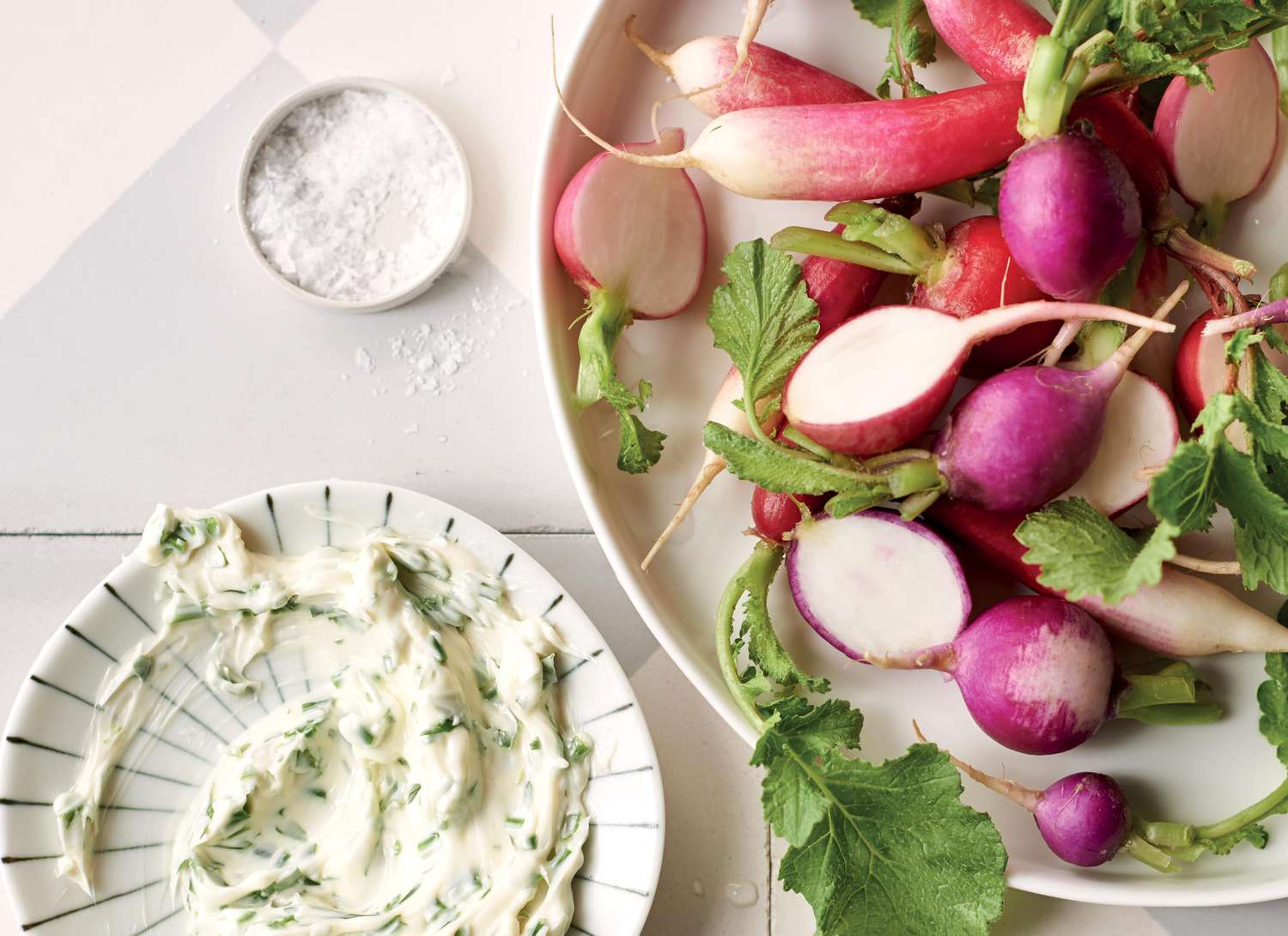 overhead view of radishes and herb dip