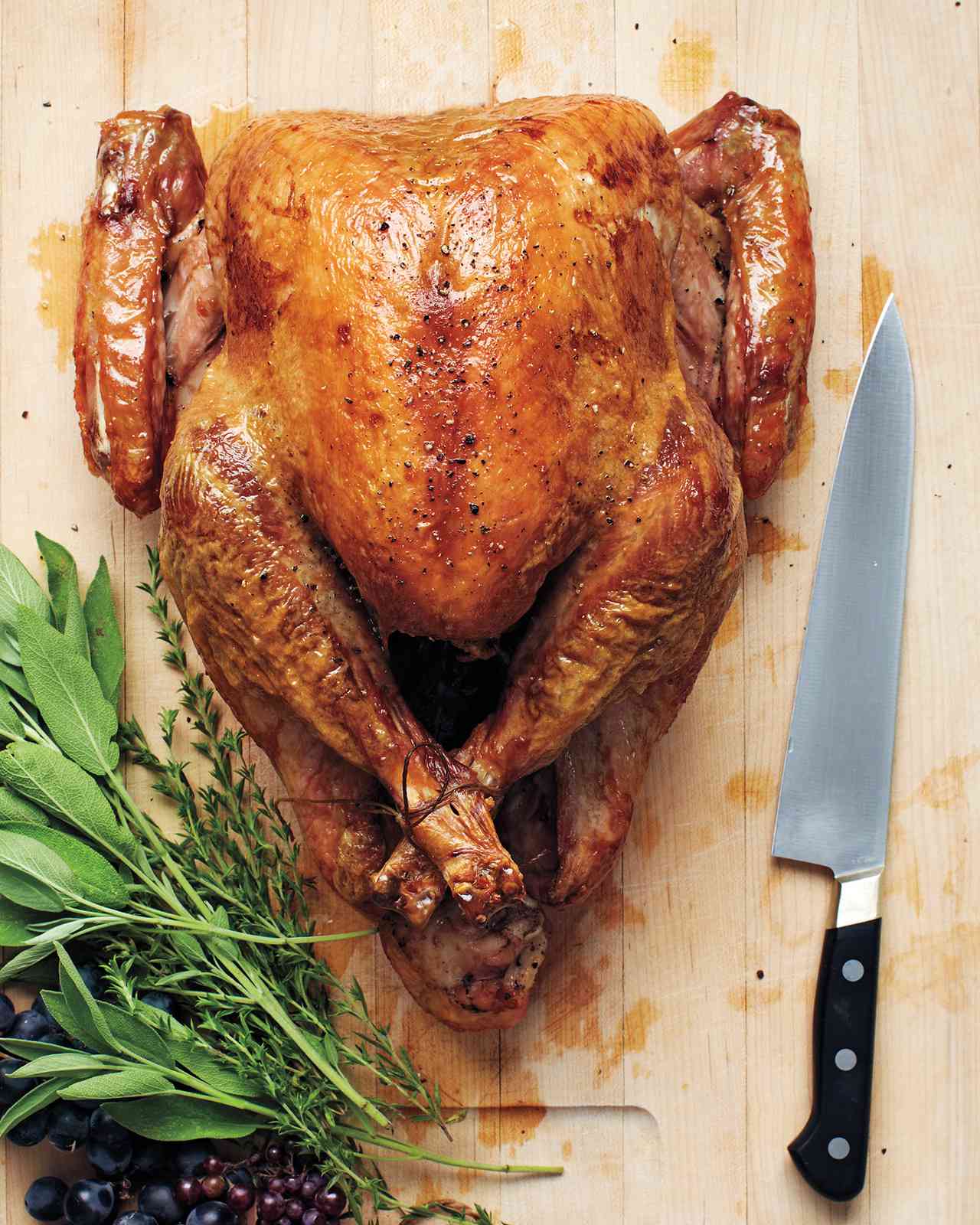 roasted turkey on wood cutting board