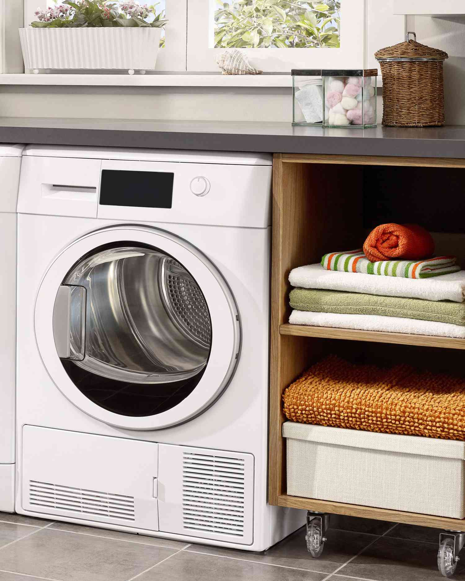 Laundry room with rolling storage cart