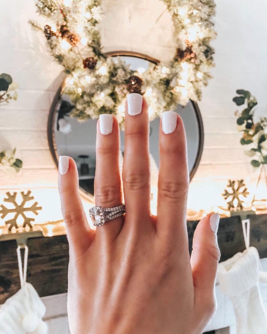 engagement ring selfie mantel with christmas decor
