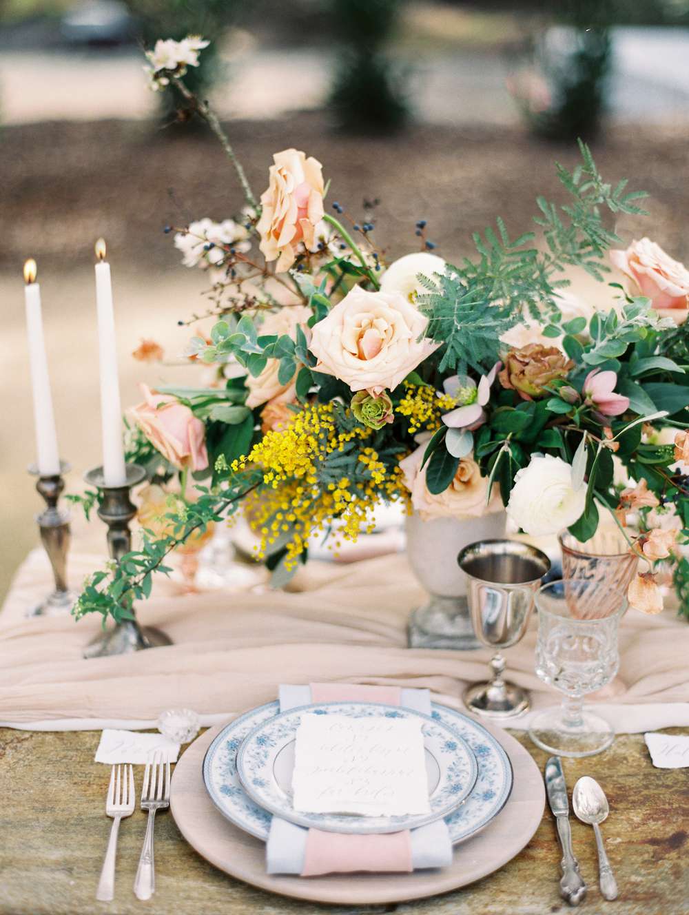 compote centerpieces pink roses and pale pink table setting