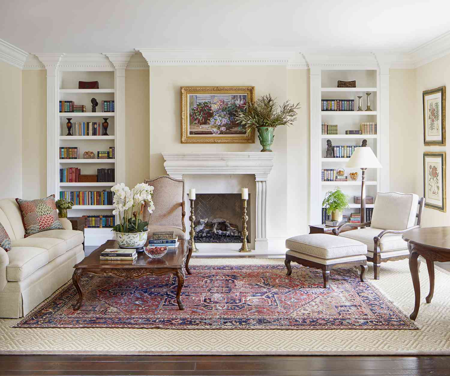 tall bookshelves with marble fireplace