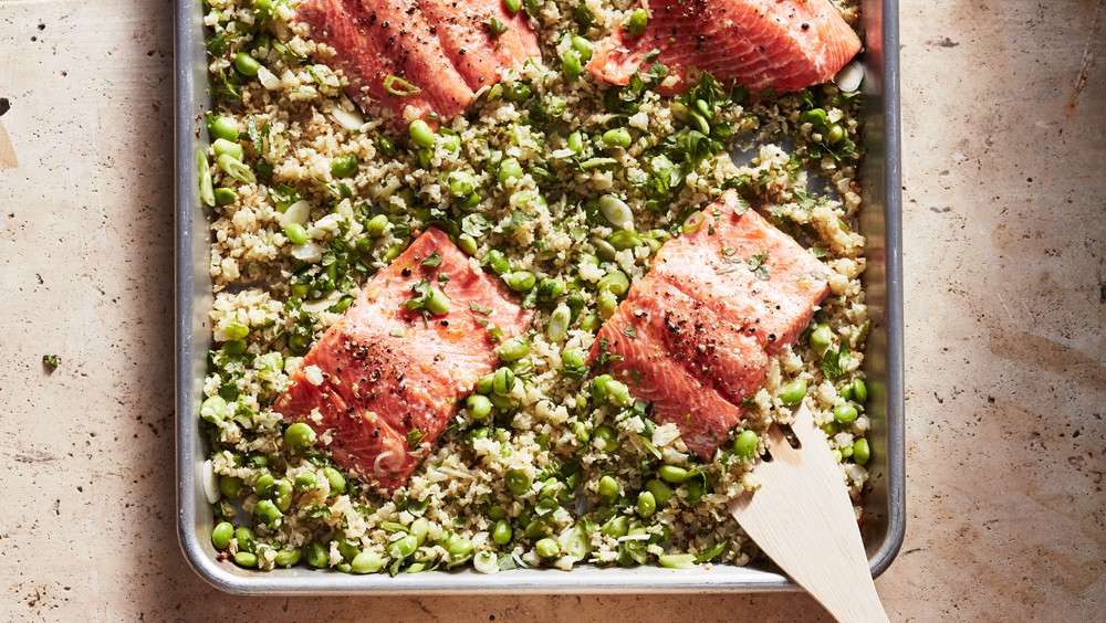 wild salmon with edamame cauliflower rice served in a pan