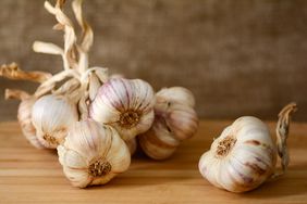 garlic bulbs on wooden surface