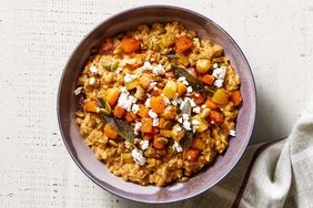 baked farro risotto with golden vegetables and goat cheese