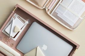pink tray with office equipment and supplies