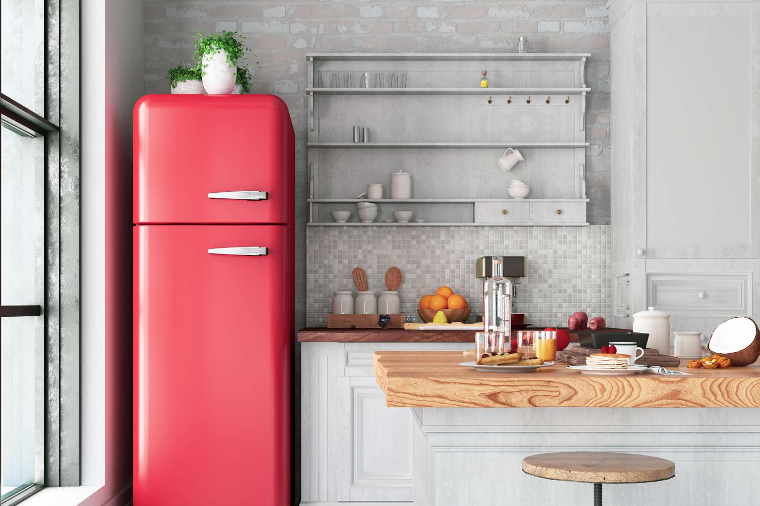 Three plants on top of a red fridge