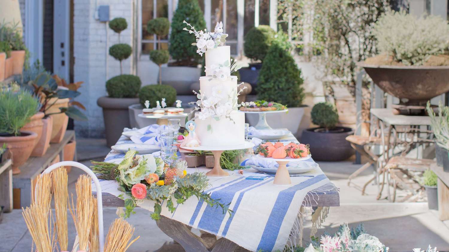 The cake table at a Peter Rabbit-themed baby shower.