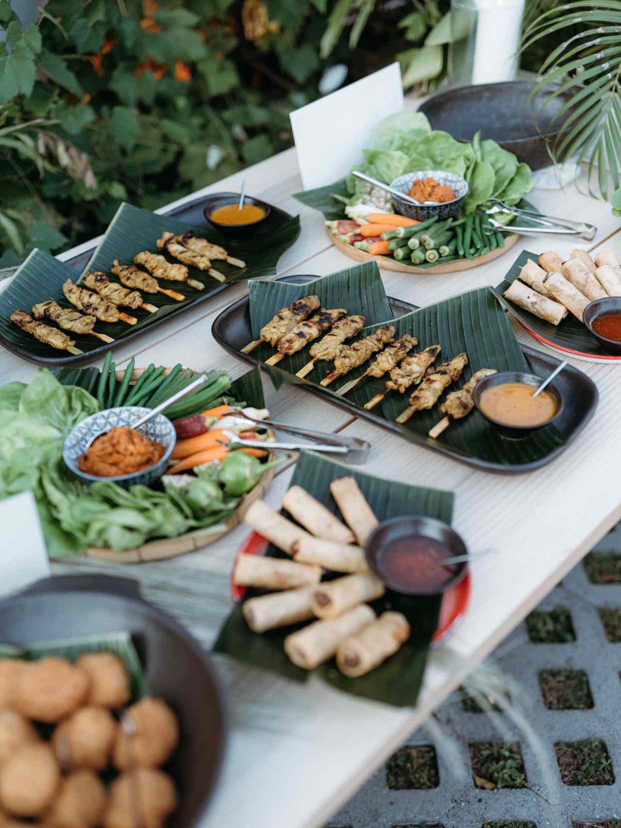 South Asian wedding food spread on wooden table