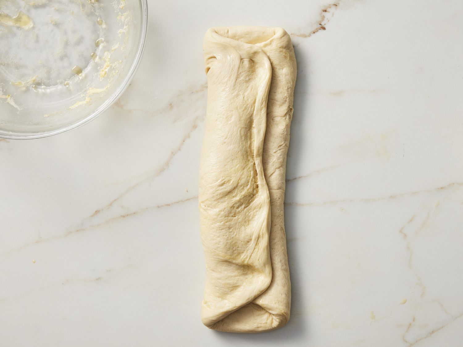 Folded dough on marble