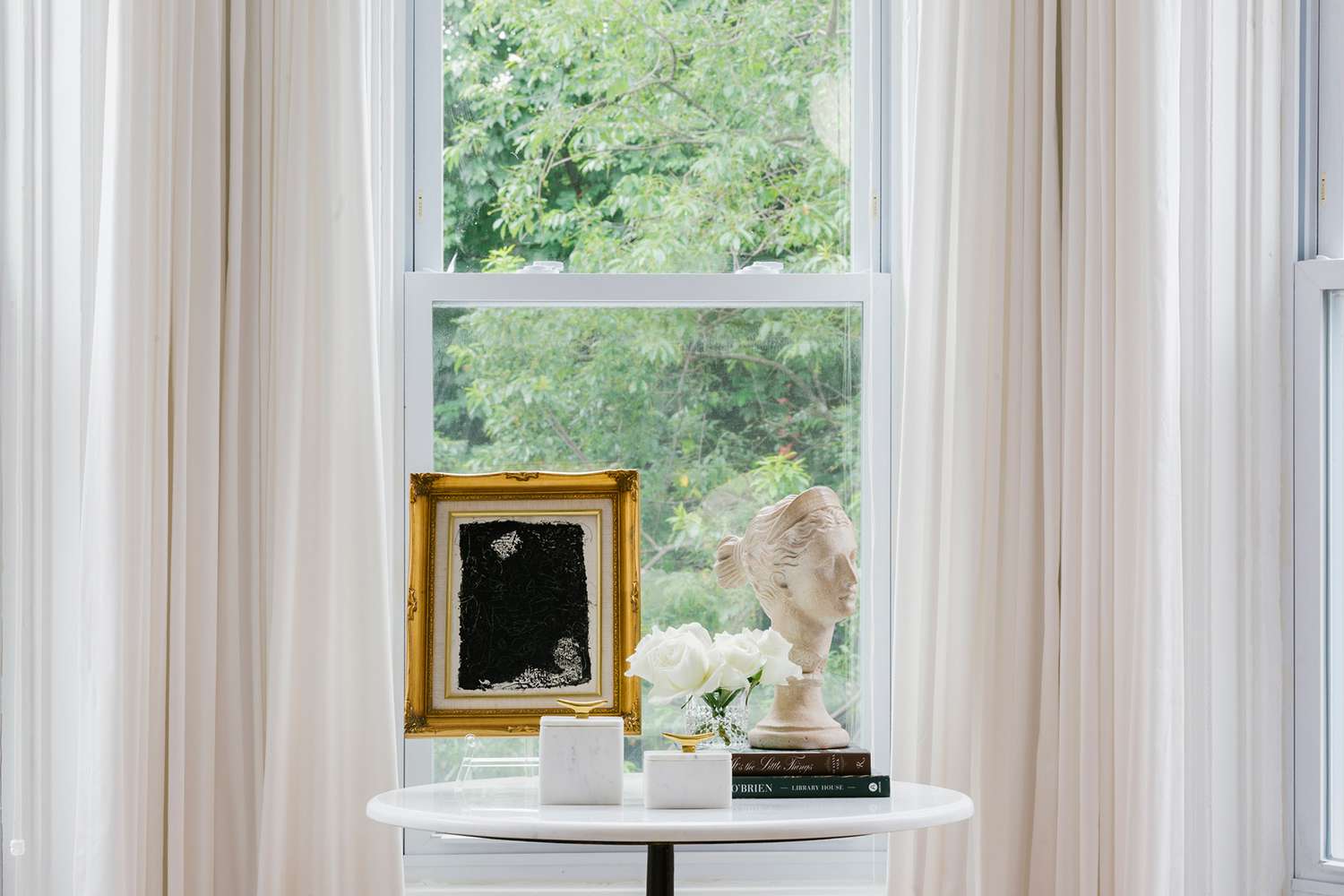 shelby nyc apartment bust on table by window