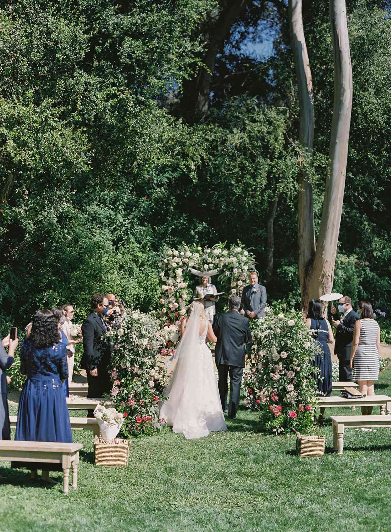 bride walking processional with dad