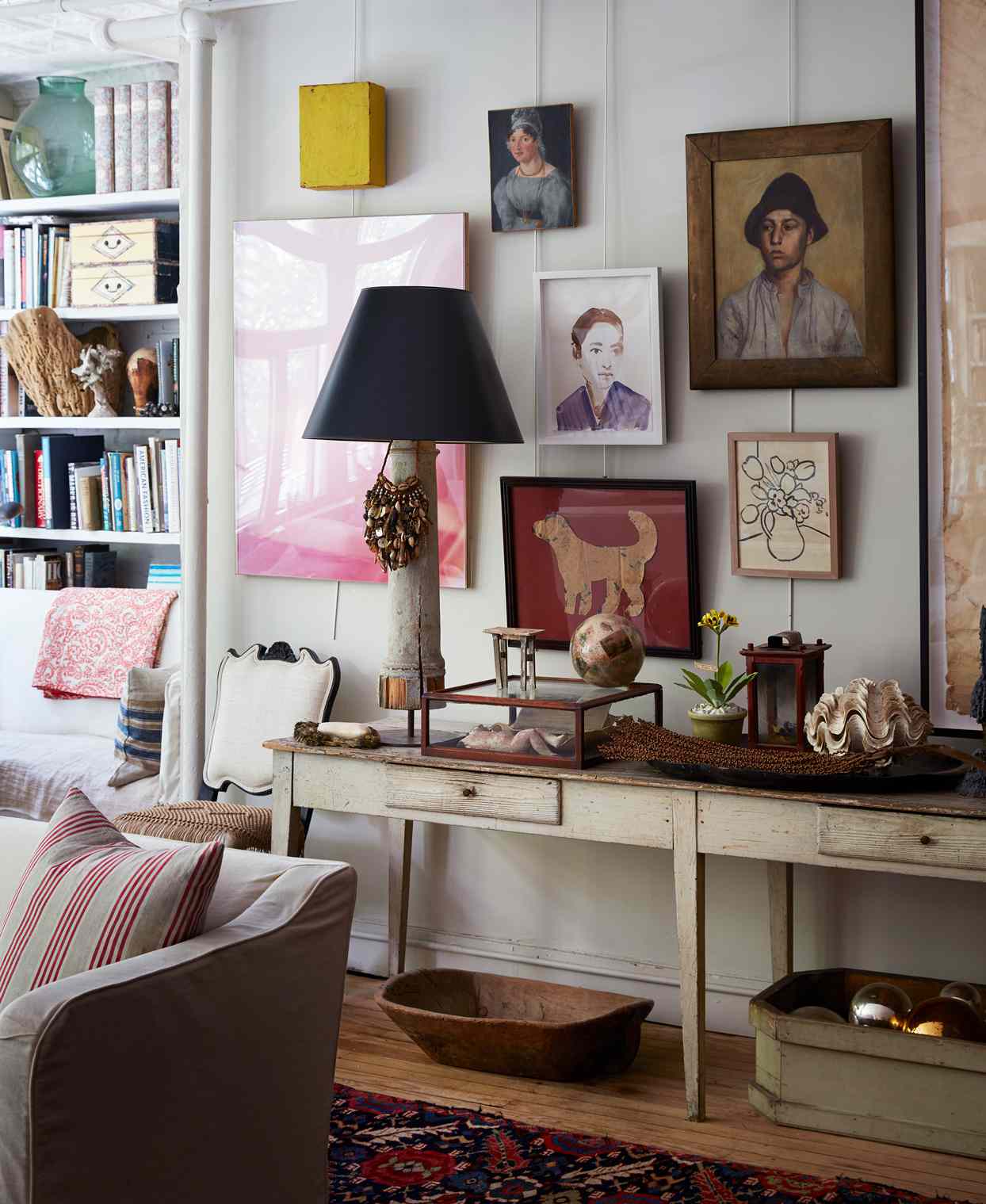 collection of wall art featuring different subjects, shapes, and sizes