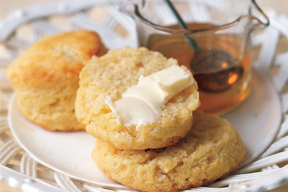 cornmeal biscuits on plate with honey