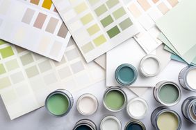Paint color swatches near open paint cans