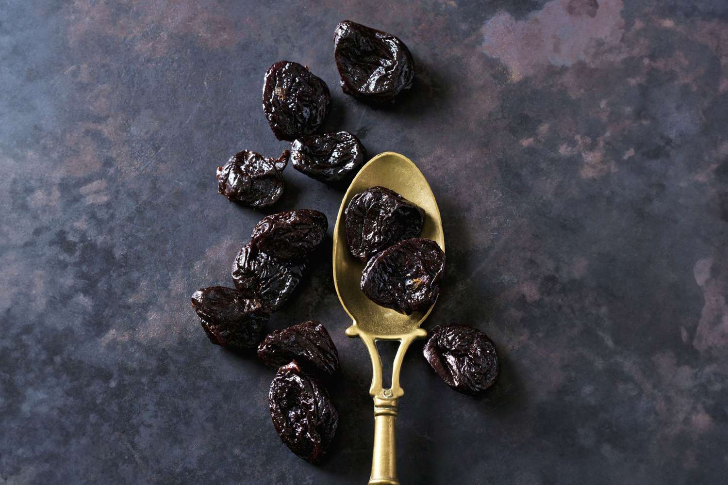 Prunes and antique spoon