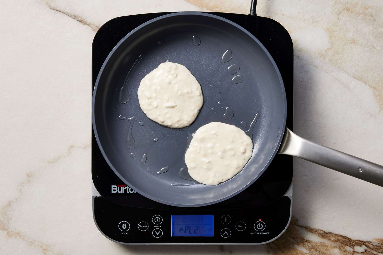 Pancakes cooking in skillet