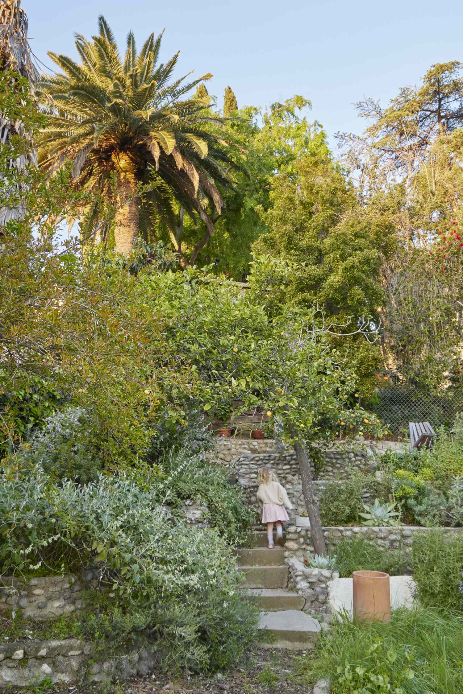Staggered retaining walls in down sloped yard