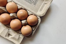 Eggs resting on a white kitchen counter. 