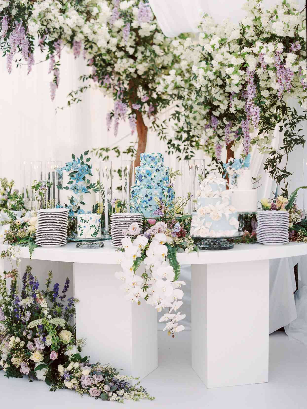dessert table with several more cakes