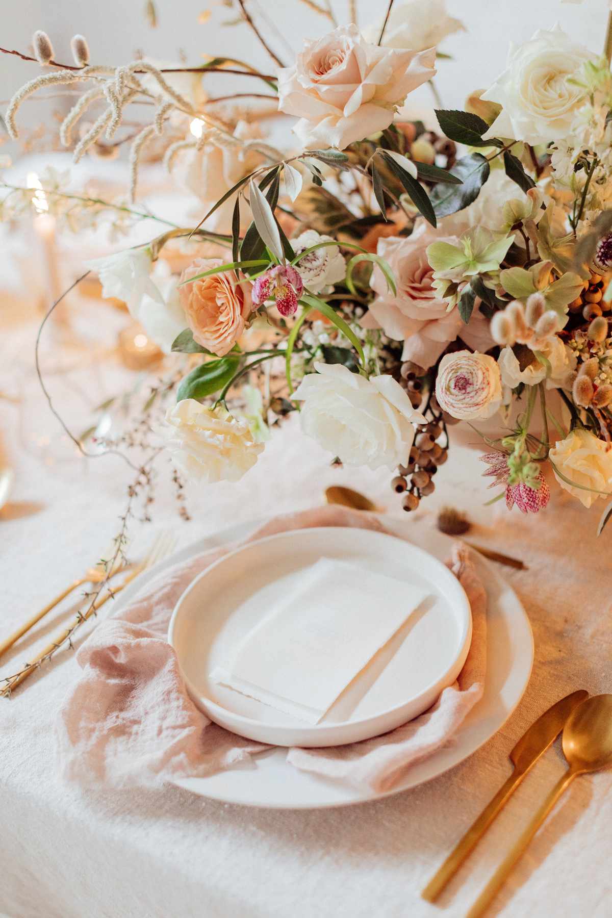 wedding reception napkin folds pink napkin draped beneath plate