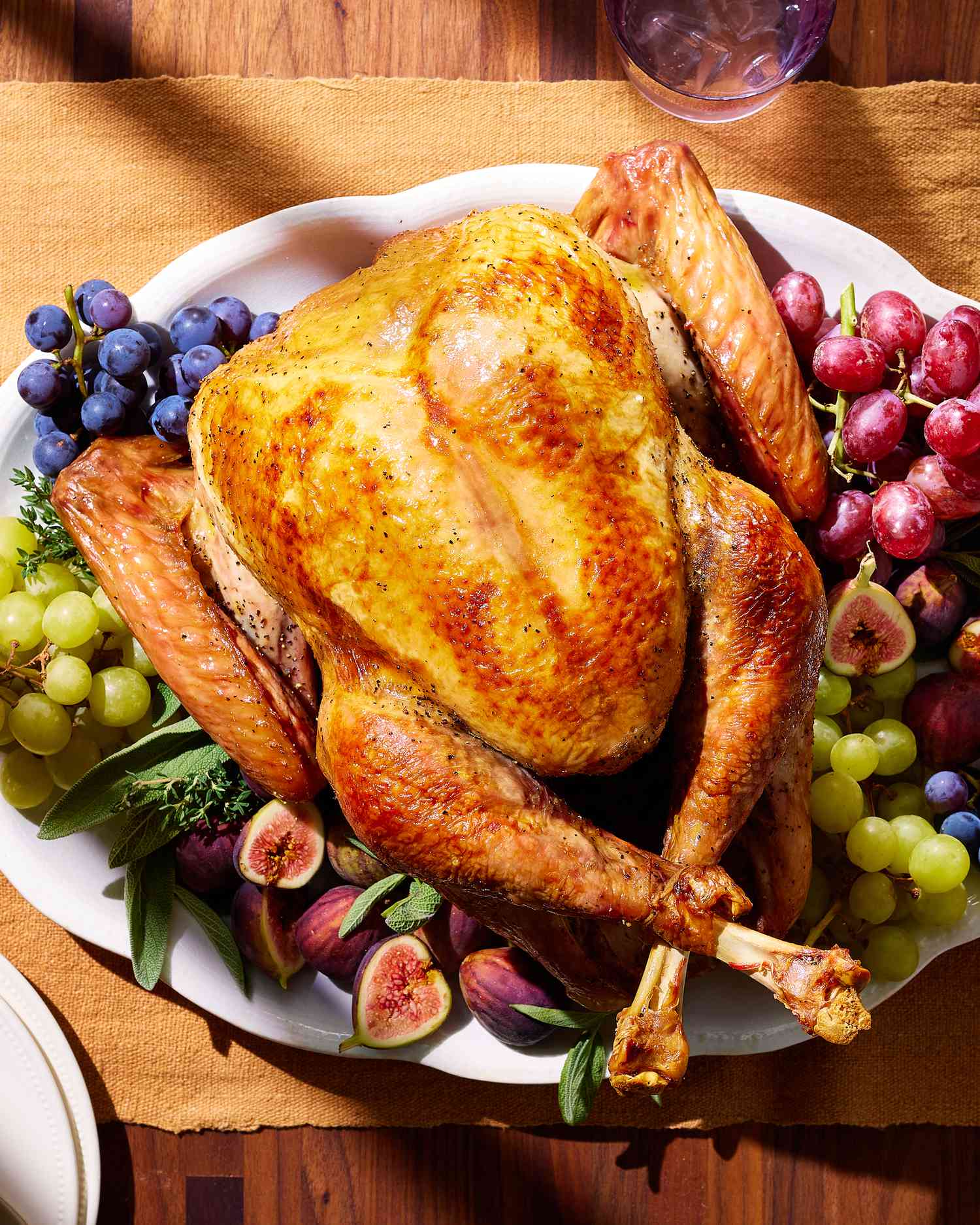 cooked turkey on a serving plate with fruit vertical